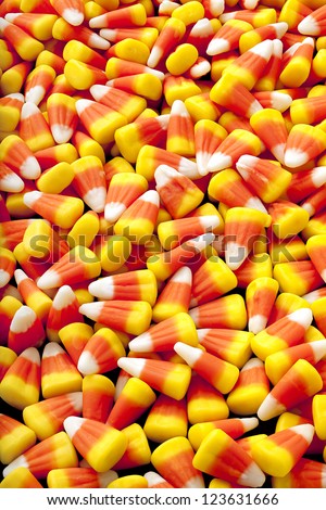 Sugar, corn syrup, fondant and marshmallow are the main ingredients to make candy corn.