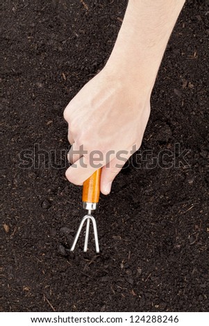 Close up image of cultivating soil