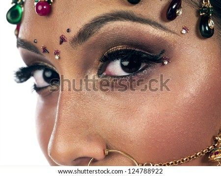 Portrait of indian woman eyes close up isolated on white background
