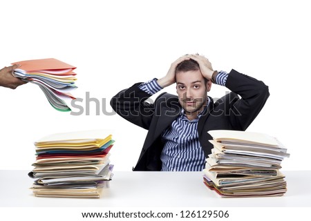 Portrait of a businessman with work overload over white background
