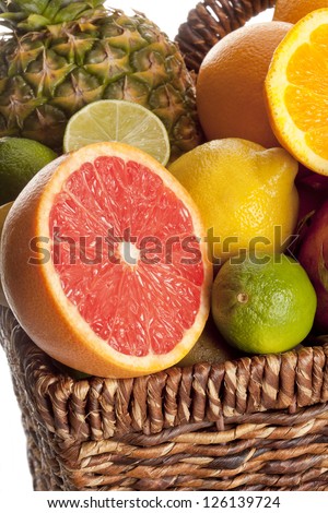 Close-up cropped view of slices of fruits in a wicker basket.