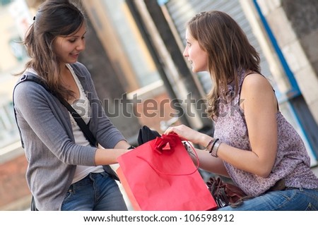 Two Girls While They Speak after to Have Made a Shopping