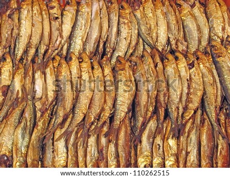smoked fish sardines and anchovies sold at fish market in Latvia