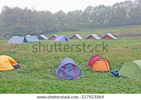 big campsite with tents of boy scouts on a cold winter day