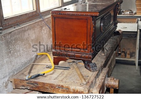 tools in a dusty carpentry workshop expert in restoration of antique furniture