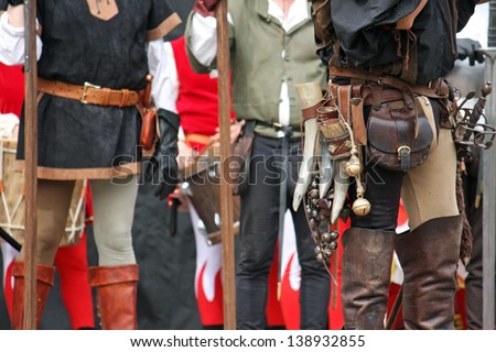 leather pants with medieval accessories during the medieval spectacle