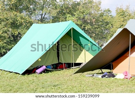 two Canadian tents set up in a boy scout camp
