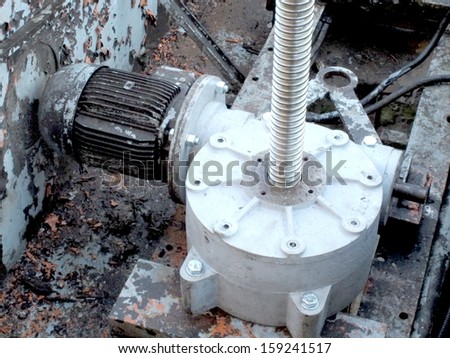 powerful industrial motor connected to the electric machine gear