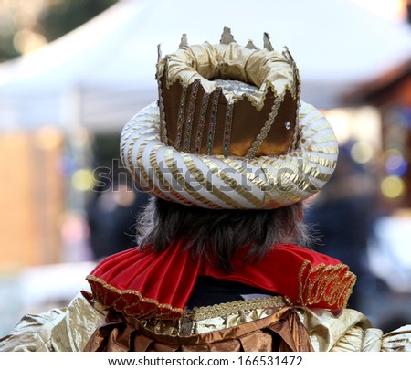 Emperor\'s Crown with a medieval dress of the time seen from behind