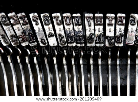 Very detailed particular letters of an old typewriter ink stained
