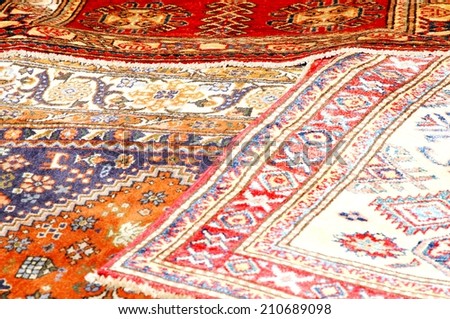 beautiful Oriental rugs in pure Virgin wool available in a stall at the market 3