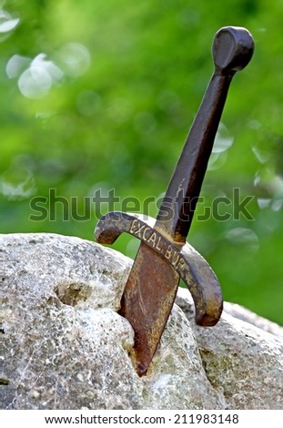 famous sword excalibur of King Arthur stuck in the rock