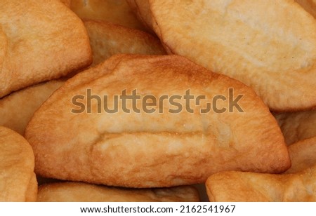 many fried panzerotti which are like sandwiches stuffed with mozzarella and tomato and then cooked in boiling oil typical Italian dish with very high caloric content Foto stock © 