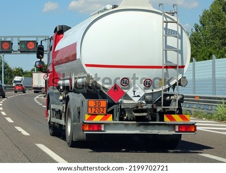large tanker truck in the busy street for transporting flammable material Foto stock © 