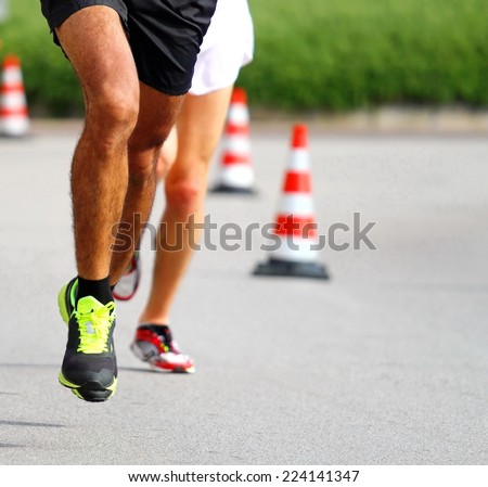 Marathoner runs very fast for the paved road in the final sprint to the finish line first
