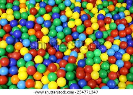 background of blue green red yellow colored spheres into a pool of balls