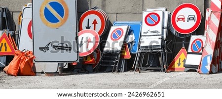 Similar – Foto Bild Viele Verkehrsschilder liegen übereinander auf dem Boden, Geschwindigkeitsbegrenzung 30 km/h, 50 km/h, Umleitung