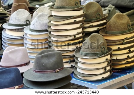 felt hats  of all sizes for sale in stand of outdoor flea market