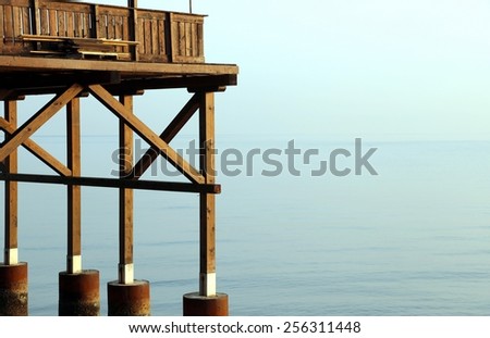detail of a big wooden stilt house on the seashore
