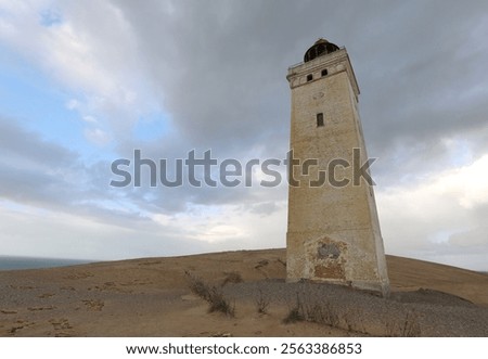 Similar – Image, Stock Photo Sandy seashore near hill with houses under cloudy sky