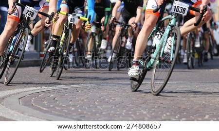 Vicenza, italy - april 12, 2015 bikers run fast on racing bikes during cycle road race
