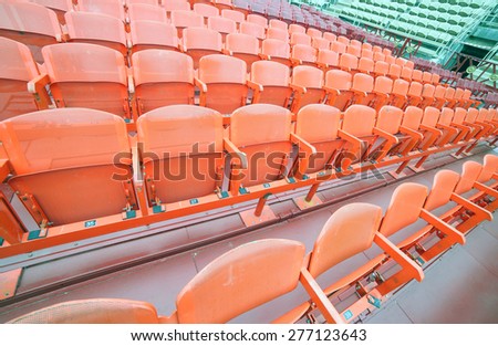 empty chairs of iron before the musical concert