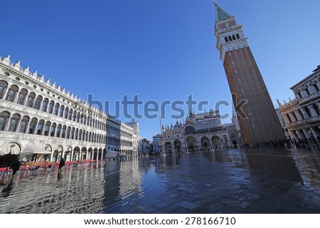 VENICE, VE, ITALY - January 31, 2015:Saint Mark\'s Basilica and campanile in the high tide in St. Mark\'s square under water