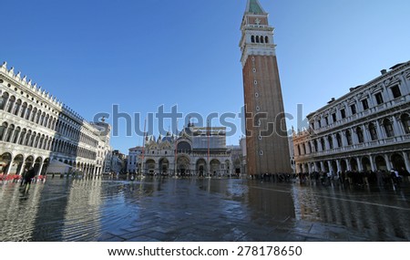 VENICE, VE, ITALY - January 31, 2015:Saint Mark\'s Basilica and campanile in the high tide in St. Mark\'s square under water
