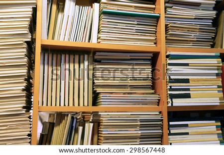 many books piled up for sale in the great library