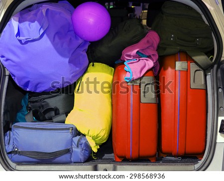 suitcases and luggage in the trunk while traveling in family
