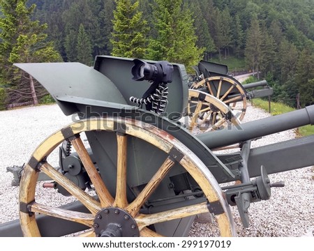 versatile camera tripod over an old World War I Cannon