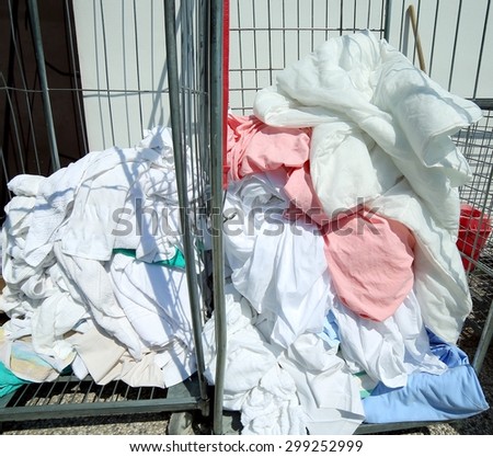 pile of dirty laundry in the industrial laundry before washing