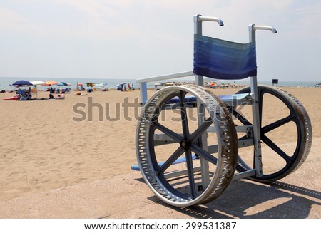 Special wheelchair to move around on the sand of the beach in summer