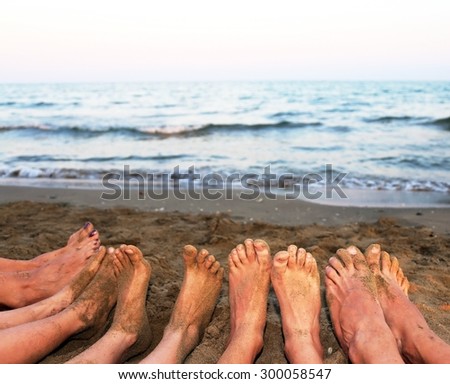 ten feet of a family by the sea on the beach in summer