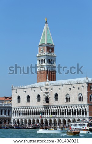Venice, VE - Italy. 14th July, 2015:  Doge\'s Palace and the Bell Tower of St Mark with many water bus and vaporetto ships on the adriatic sea
