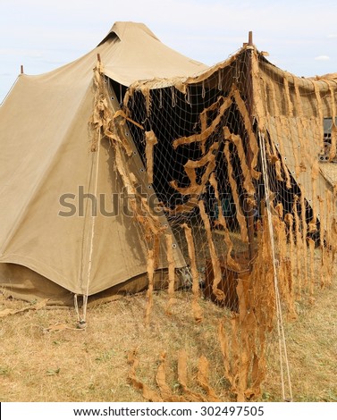 camouflage military tent in the camp of training of new army recruits