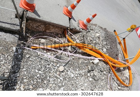 Road construction with pipes for laying optical fiber for high speed internet