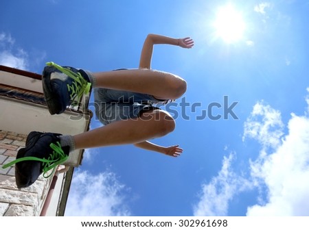 highest jump of a child and the blue sky in summer
