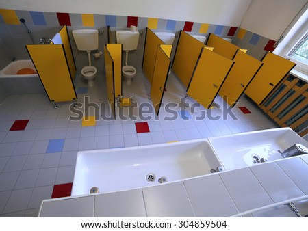 small ceramic toilets in the bathroom of the kindergarten