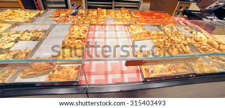 slice of pizza bread for sale in Italian bakery