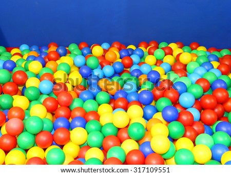 school gym in the kindergarten with many colored plastic balls