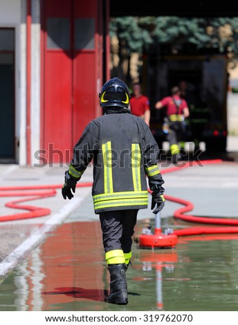 isolated Italian fireman with protective uniform and helmet on his head
