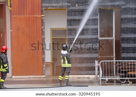 Firefighters extinguished the fire in the building during practice in the fire station