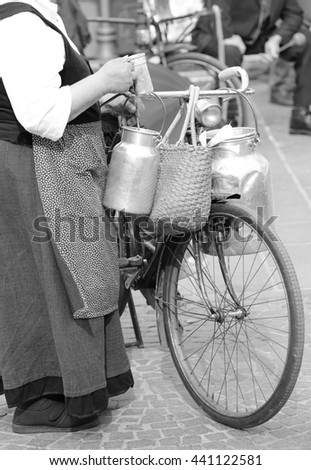 Similar – Image, Stock Photo Very old milk churns made of sheet metal with handle and lid. On one pot is the word “kitchen”.