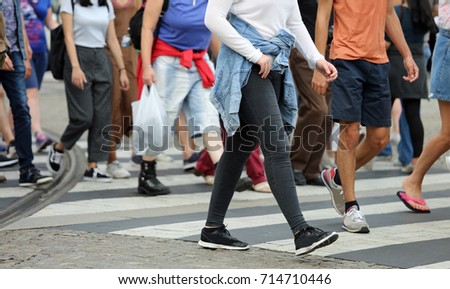 many legs of people crossing the pedestrian crossing in the busy street of the metropolis in the summer Stock fotó © 