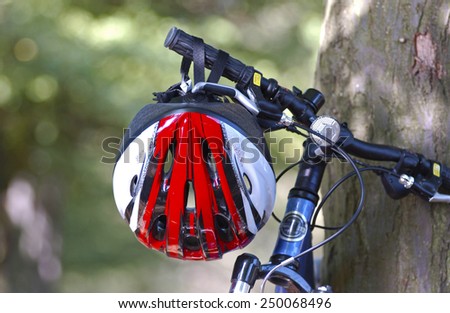 Red Cycle helmet on handlebars