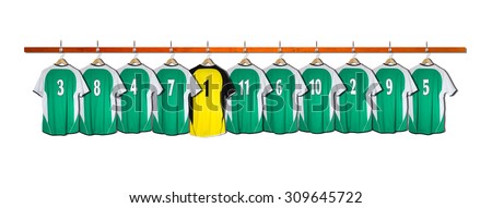 Row of Green Football Shirts with Yellow Goalie Shirt 3-5