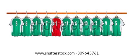 Row of Green Football Shirts with Red Goalie Shirt 3-5