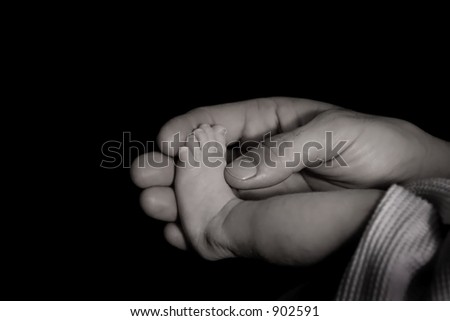 Father holding Daughters foot