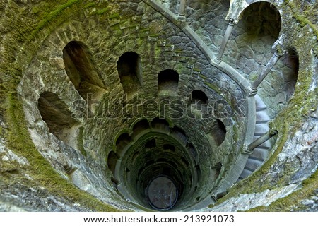 The Initiation well of Quinta da Regaleira in Sintra, Portugal. It\'s a 27 meter staircase that leads straight down underground and connects with other tunnels via underground walkways